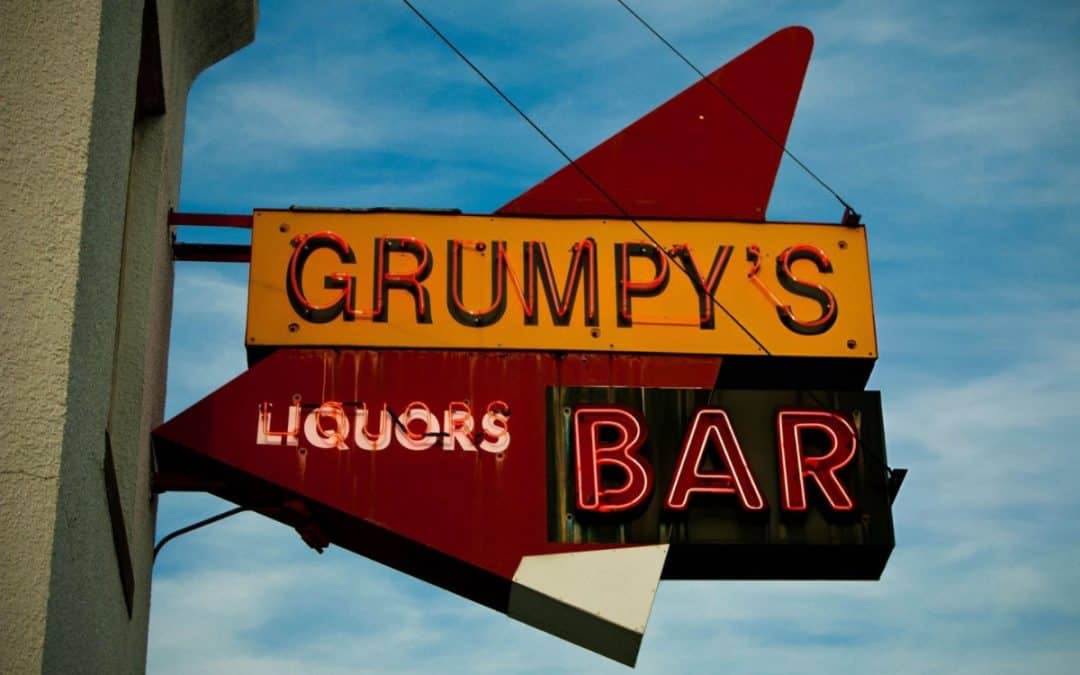 The neon sign affixed to the outside of Grumpy's NE.